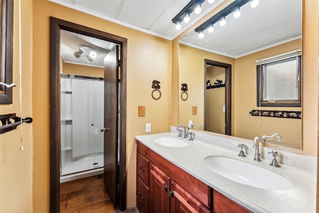 361 Lagoon Ln, Silverthorne, CO 80498 - bathroom with ornamental molding, double vanity, a shower, and wood finished floors