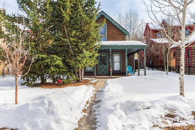 110 S Harris St, Breckenridge, CO 80424 - view of front facade with fence and covered porch