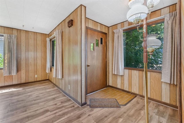 190 N Walnut St, Hayden, CO 81639 - foyer featuring wood finished floors, a chandelier, and wooden walls