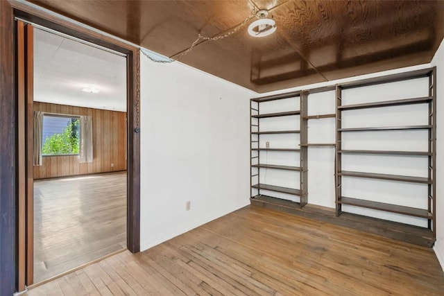 190 N Walnut St, Hayden, CO 81639 - unfurnished room with hardwood / wood-style floors and wood walls