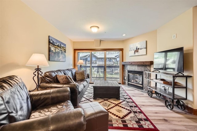 22787 US Highway 6 Unit 313, Keystone, CO 80435 - living room with light wood-style flooring and a fireplace
