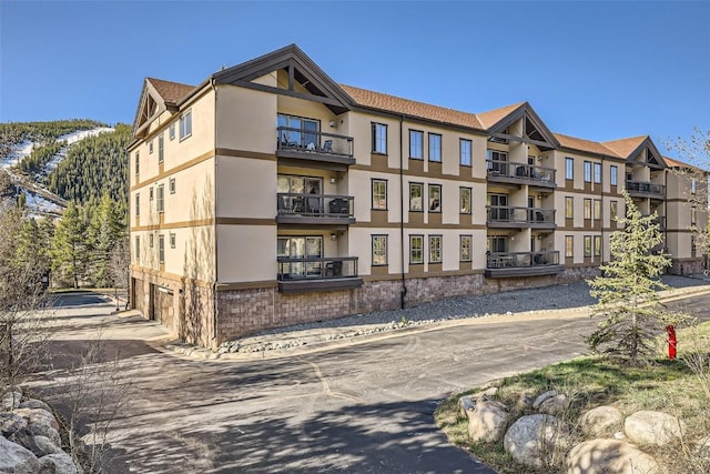22787 US Highway 6 Unit 313, Keystone, CO 80435 - view of apartment building / complex featuring an attached garage and concrete driveway