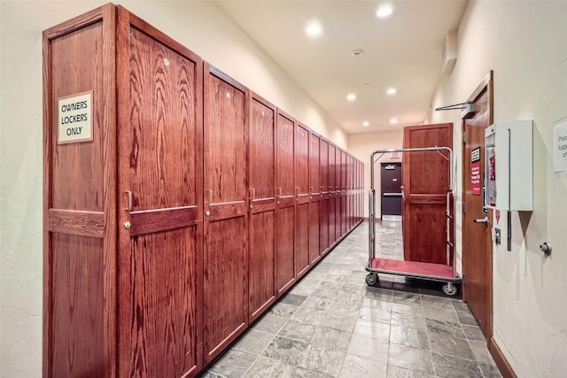 22787 US Highway 6 Unit 313, Keystone, CO 80435 - hall with recessed lighting and light stone finish flooring