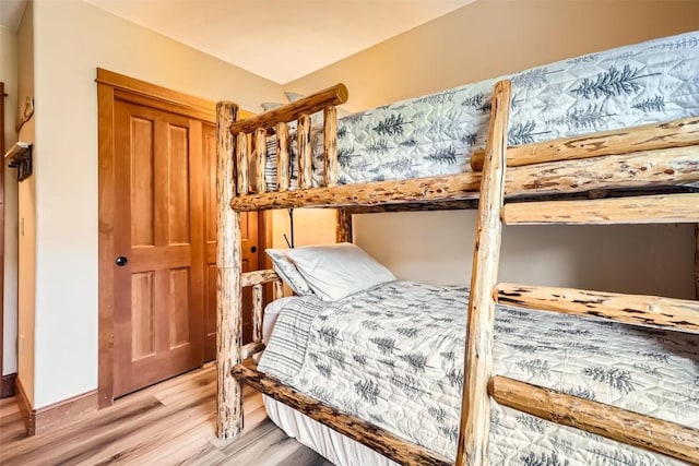22787 US Highway 6 Unit 313, Keystone, CO 80435 - bedroom with light wood finished floors