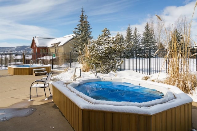 1532 Moraine Cir Unit 40, Steamboat Springs, CO 80487 - snow covered pool featuring fence, a hot tub, and a patio