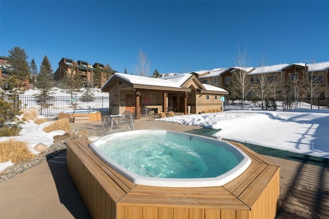 1532 Moraine Cir Unit 40, Steamboat Springs, CO 80487 - snow covered pool with fence, an outdoor hot tub, and a patio