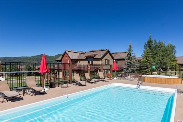 1532 Moraine Cir Unit 40, Steamboat Springs, CO 80487 - community pool featuring fence, a mountain view, and a patio