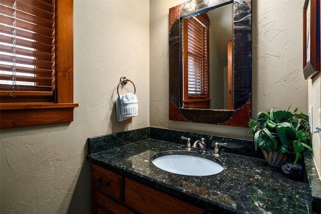 1532 Moraine Cir Unit 40, Steamboat Springs, CO 80487 - bathroom with a textured wall and vanity