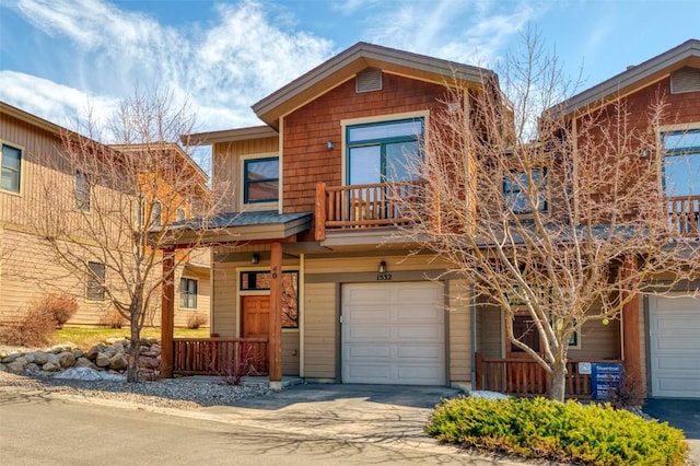 1532 Moraine Cir Unit 40, Steamboat Springs, CO 80487 - view of front of property featuring a garage, driveway, a porch, and a balcony