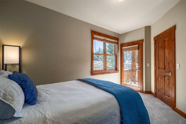 1532 Moraine Cir Unit 40, Steamboat Springs, CO 80487 - carpeted bedroom with baseboards and access to exterior