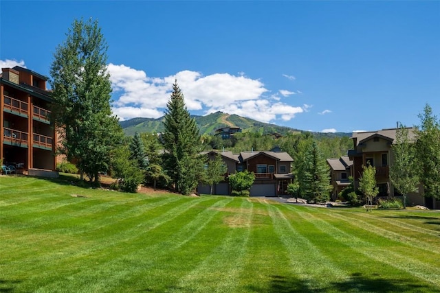 1532 Moraine Cir Unit 40, Steamboat Springs, CO 80487 - view of yard with an attached garage and a mountain view