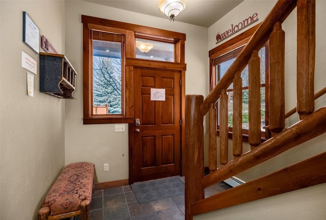 1532 Moraine Cir Unit 40, Steamboat Springs, CO 80487 - entryway featuring baseboards, stone finish flooring, and stairs
