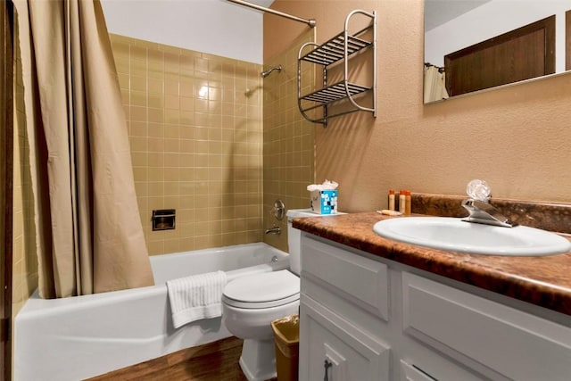 107 N Harris St Unit 209, Breckenridge, CO 80424 - full bath featuring toilet, shower / bath combo with shower curtain, wood finished floors, a textured wall, and vanity