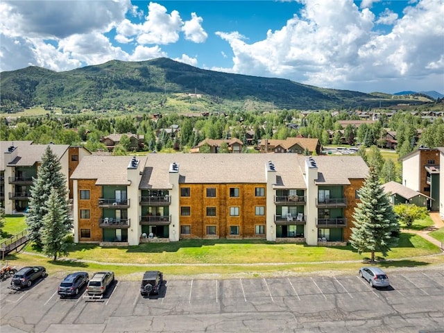 birds eye view of property with a mountain view