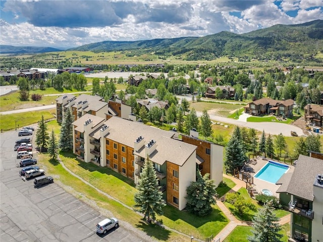 drone / aerial view with a residential view and a mountain view