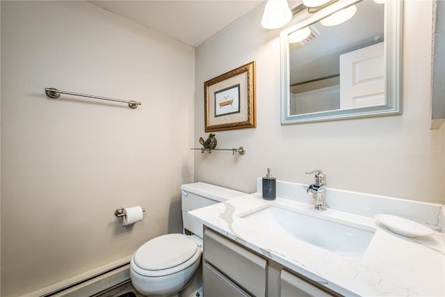 bathroom featuring a baseboard radiator, toilet, and vanity
