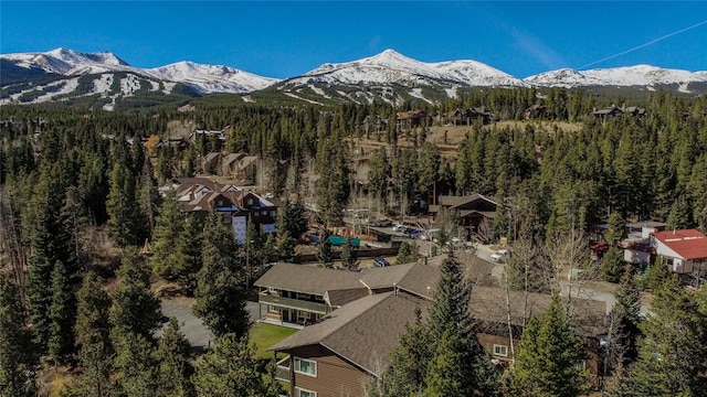 property view of mountains featuring a view of trees