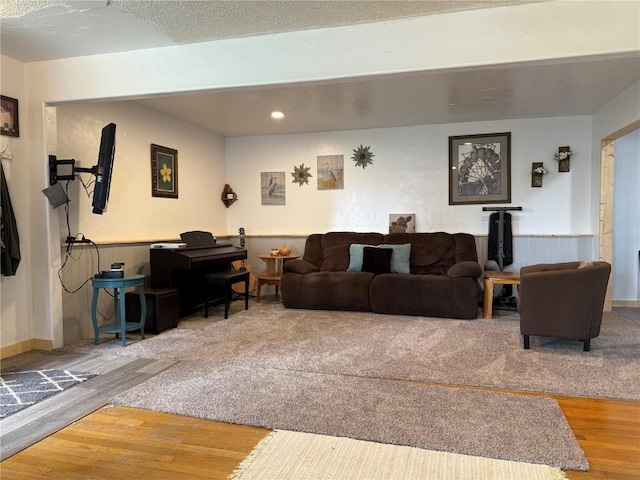 635 School St, Craig, CO 81625 - living room with wood finished floors, wainscoting, and recessed lighting