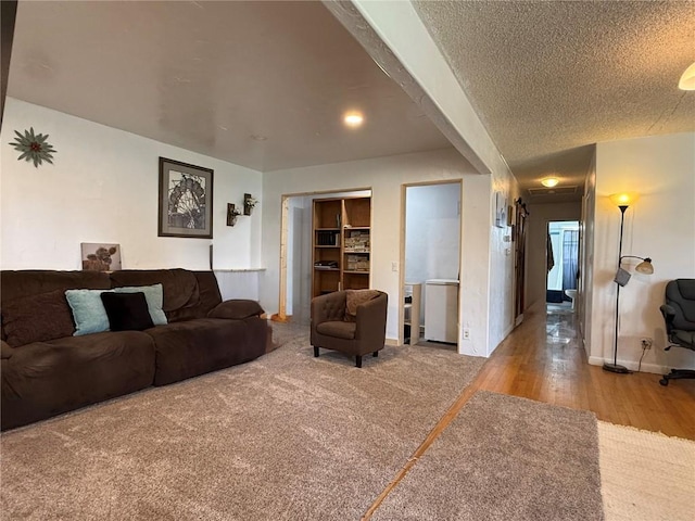 635 School St, Craig, CO 81625 - living area with wood finished floors, baseboards, and a textured ceiling