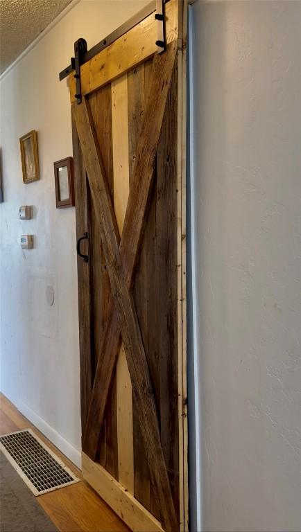 635 School St, Craig, CO 81625 - detailed view of a barn door and wood finished floors