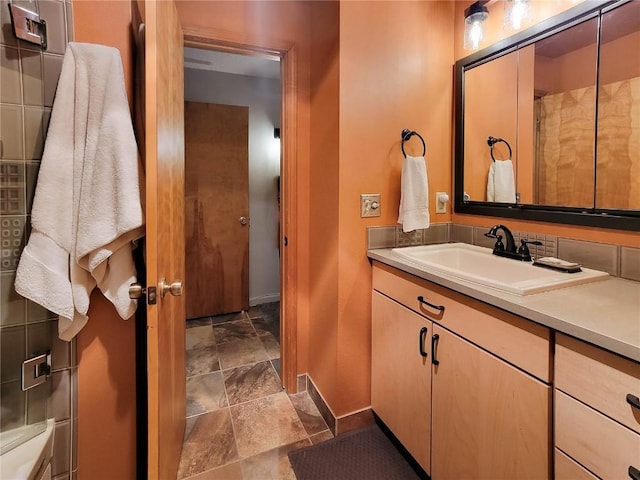 72 Corinthian Cir Unit 303, Dillon, CO 80435 - bathroom featuring stone tile floors and vanity