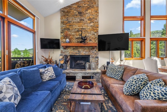 22300 US Highway 6 Unit 1746, Keystone, CO 80435 - living room with high vaulted ceiling, a fireplace, and wood finished floors