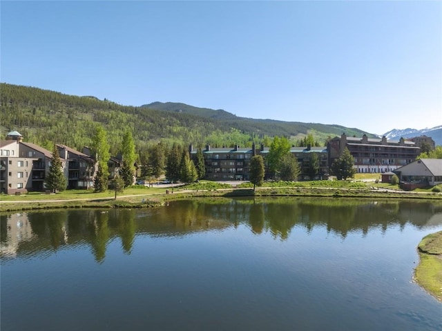 22300 US Highway 6 Unit 1746, Keystone, CO 80435 - water view with a mountain backdrop and a heavily wooded area