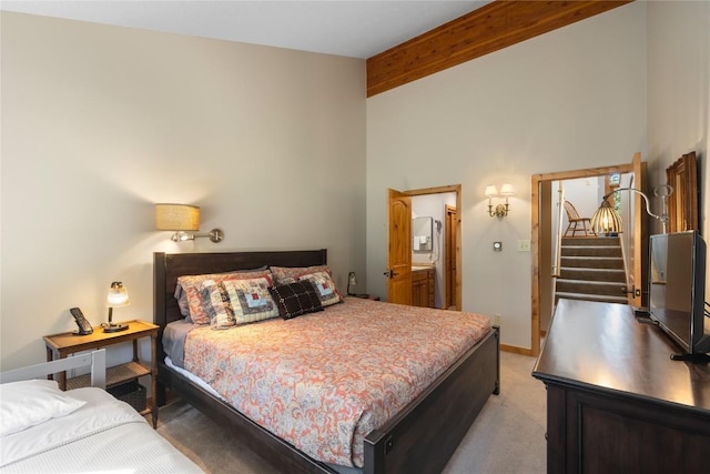 22300 US Highway 6 Unit 1746, Keystone, CO 80435 - bedroom with beamed ceiling, light carpet, and high vaulted ceiling