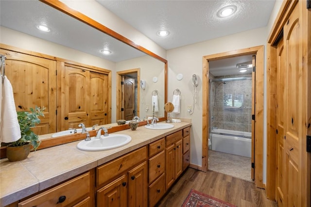 22300 US Highway 6 Unit 1746, Keystone, CO 80435 - bathroom with double vanity, wood finished floors, and shower / bath combination with glass door