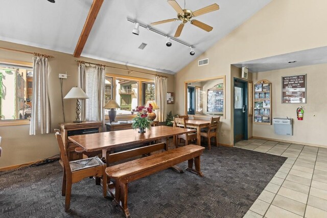 dining space with track lighting, visible vents, light tile patterned floors, high vaulted ceiling, and ceiling fan