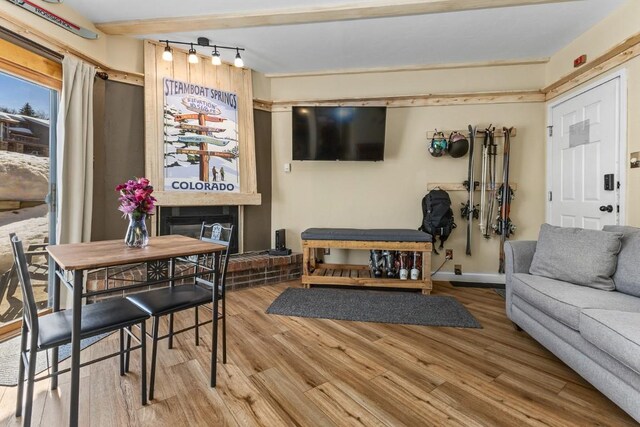 living room featuring baseboards and wood finished floors