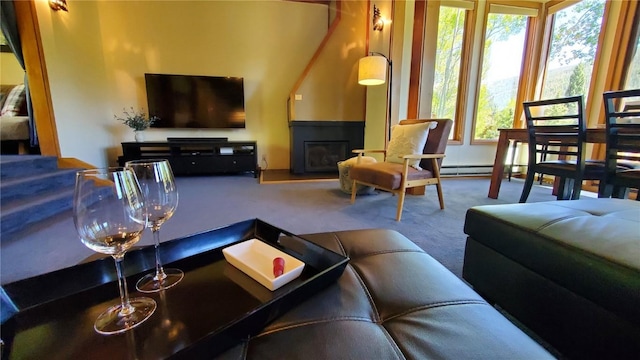 620 Tennis Club Rd Unit 1337, Keystone, CO 80435 - carpeted living area with stairs, a glass covered fireplace, and baseboard heating