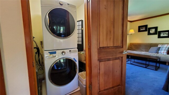 620 Tennis Club Rd Unit 1337, Keystone, CO 80435 - washroom with stacked washer / drying machine, carpet floors, and ornamental molding