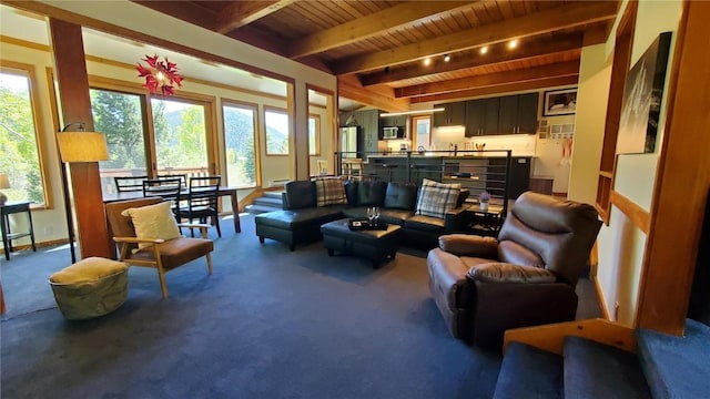 620 Tennis Club Rd Unit 1337, Keystone, CO 80435 - carpeted living area featuring a wood ceiling with exposed beams