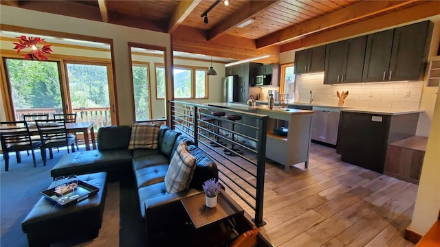 620 Tennis Club Rd Unit 1337, Keystone, CO 80435 - living area featuring a wood ceiling with exposed beams and light wood-style floors
