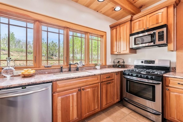 51193 Smith Creek Park Rd, Steamboat Springs, CO 80487 - kitchen with stainless steel appliances, a sink, light stone countertops, beamed ceiling, and wooden ceiling