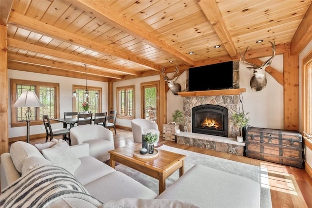 51193 Smith Creek Park Rd, Steamboat Springs, CO 80487 - living room featuring wood finished floors, baseboards, plenty of natural light, wood ceiling, and beamed ceiling