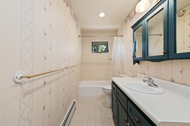 203 Spruce St, Steamboat Springs, CO 80487 - full bath with vanity, toilet, baseboard heating, tile patterned flooring, and shower / tub combo