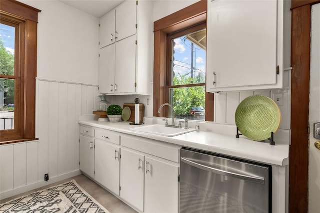 203 Spruce St, Steamboat Springs, CO 80487 - kitchen featuring stainless steel dishwasher, a sink, light countertops, and plenty of natural light