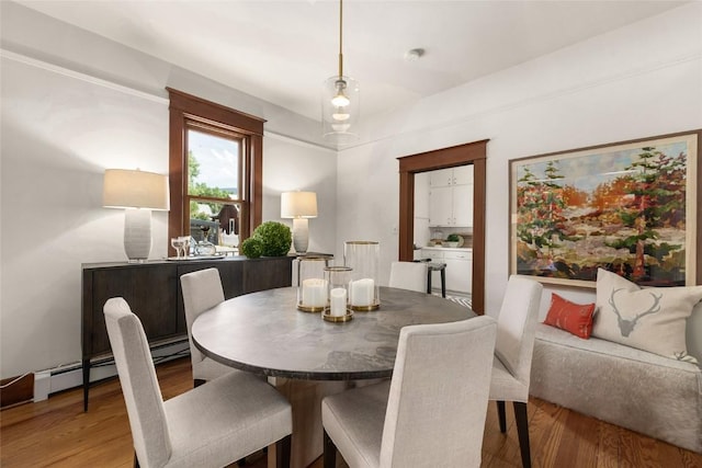 203 Spruce St, Steamboat Springs, CO 80487 - dining area featuring light wood finished floors and baseboard heating