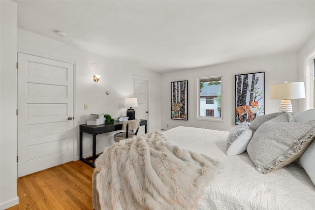 203 Spruce St, Steamboat Springs, CO 80487 - bedroom with multiple windows and light wood-style floors