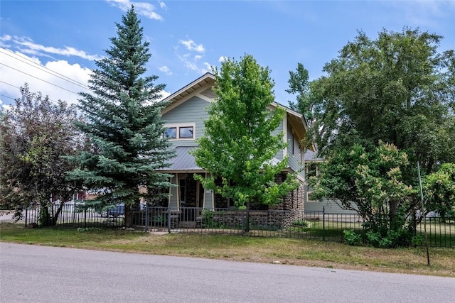 203 Spruce St, Steamboat Springs, CO 80487 - view of property hidden behind natural elements featuring a fenced front yard