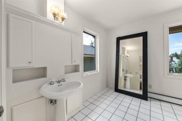 203 Spruce St, Steamboat Springs, CO 80487 - bathroom with a baseboard radiator, a sink, and tile patterned floors