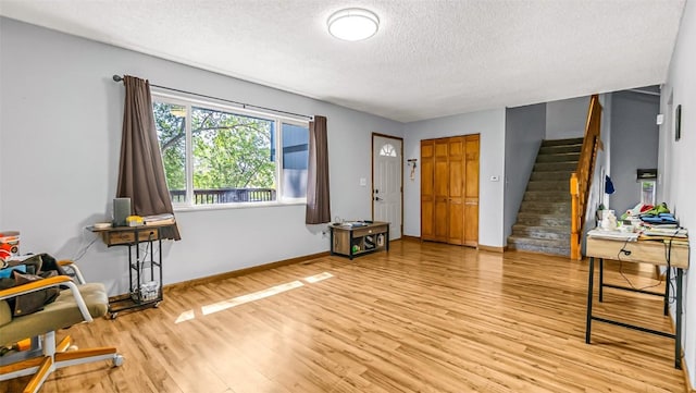 1226 Barclay St, Craig, CO 81625 - foyer featuring a textured ceiling, stairway, and light wood-style floors