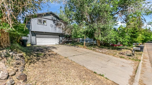1226 Barclay St, Craig, CO 81625 - view of front of property with a garage and driveway