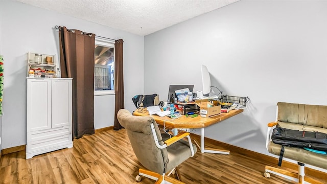 1226 Barclay St, Craig, CO 81625 - office area with light wood-style floors and a textured ceiling