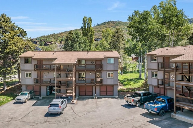 2930 Columbine Dr Unit 102, Steamboat Springs, CO 80487 - view of building exterior featuring driveway and a mountain view