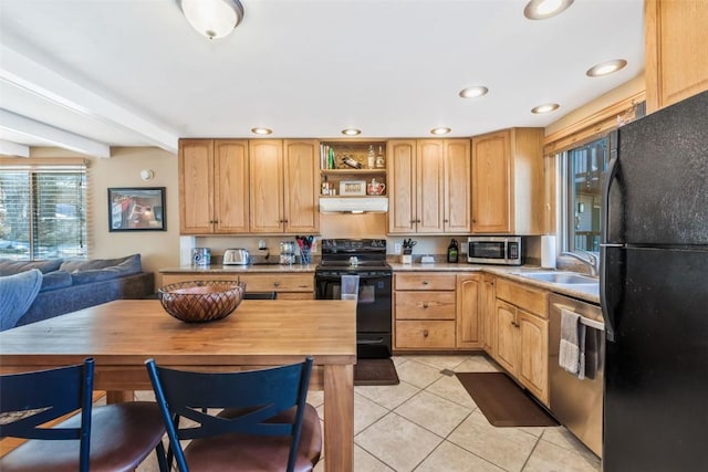 kitchen featuring a sink, black appliances, light countertops, under cabinet range hood, and light tile patterned floors