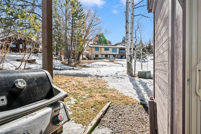 view of yard covered in snow