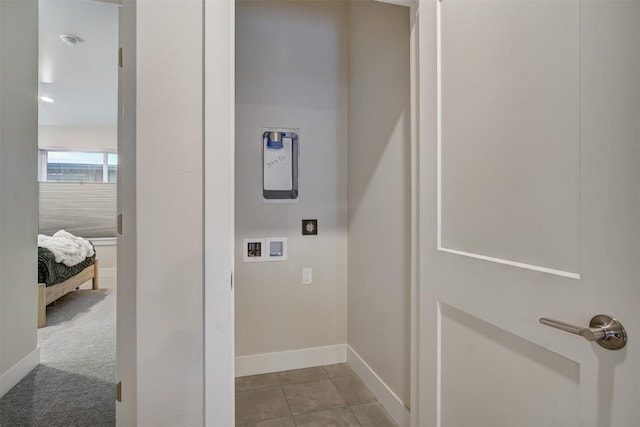 laundry area featuring electric dryer hookup, hookup for a washing machine, laundry area, and baseboards